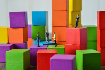 Close-up of figurines on toy blocks