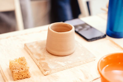 High angle view of cup and coffee on table
