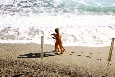 Full length of woman on beach