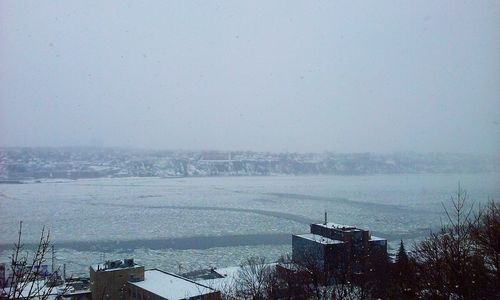 Scenic view of sea against sky during winter