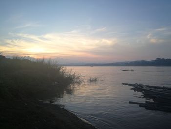 Scenic view of lake against sky during sunset