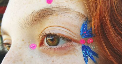 Cropped image of woman with eye make-up during carnival