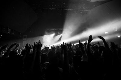 People enjoying music concert at night