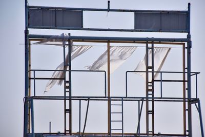 Low angle view of construction site against sky