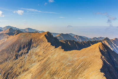 Aerial view of mountains against sky