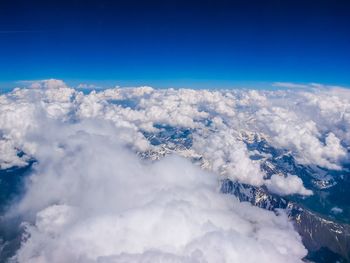 Aerial view of snow covered mountains