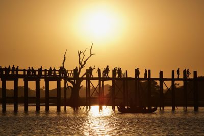 Scenic view of bridge against sky during sunset