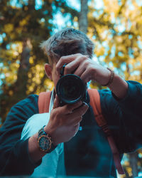 Portrait of man photographing