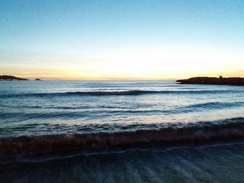 Scenic view of sea at sunset