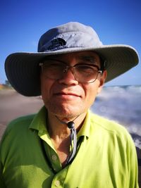 Portrait of man wearing sun hat against clear sky