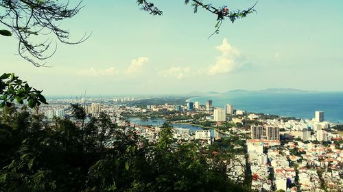 Panoramic shot of city against cloudy sky