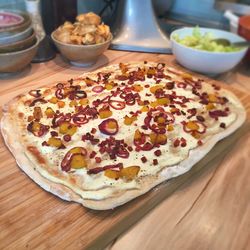 Close-up of tarte flambée on wooden table