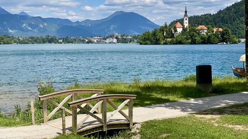 Scenic view of lake and mountains against sky