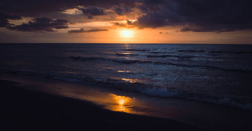 Scenic view of sea against sky during sunset