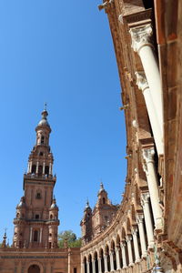 Low angle view of building against clear blue sky