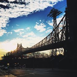 Built structures against sky at sunset