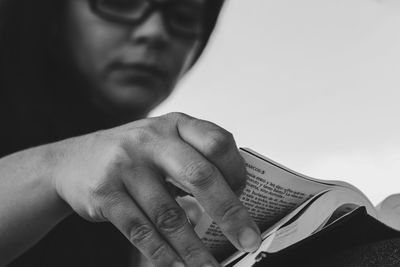 Close-up of man holding book