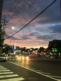 View of city street at sunset