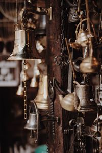 Close-up of bells hanging at market
