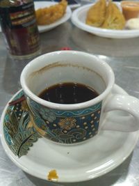 Close-up of tea cup on table