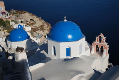 High angle view of people outside building by sea