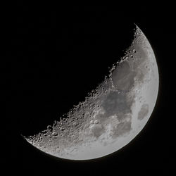 Low angle view of moon against sky at night