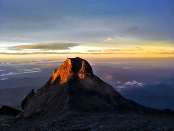 Scenic view of mountain against sky during sunset