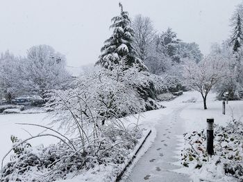 Snow covered road against sky