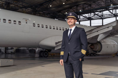 Rear view of man standing on airport