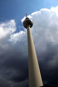 Low angle view of fernsehturm tower against sky