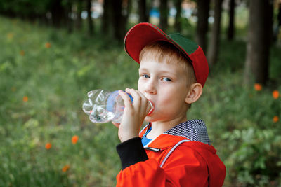 Portrait of cute boy holding bubbles