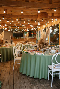 Empty chairs and tables in restaurant