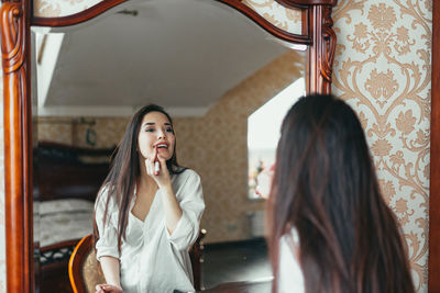 Beautiful woman smiling in corridor