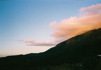 Scenic view of silhouette mountains against sky during sunset