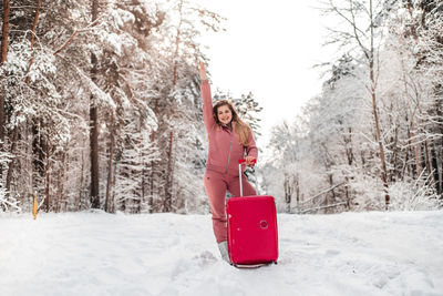 Portrait of happy woman in snow