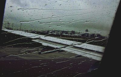 Full frame shot of wet window in rainy season