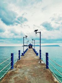 Pier over sea against sky