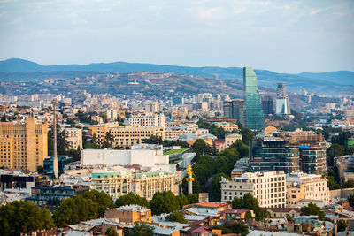 High angle view of buildings in city against sky