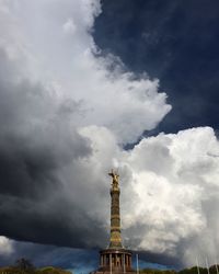 Low angle view of statue against cloudy sky