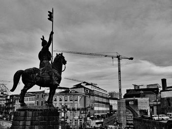 Low angle view of statue against sky