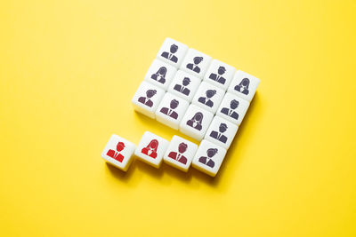 Close-up of toy blocks on yellow background