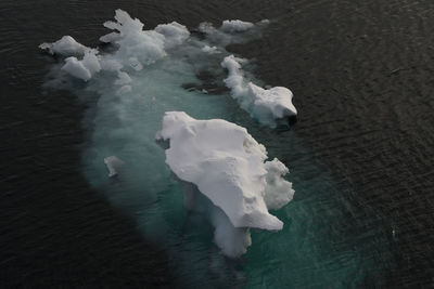 High angle view of ice floating on sea