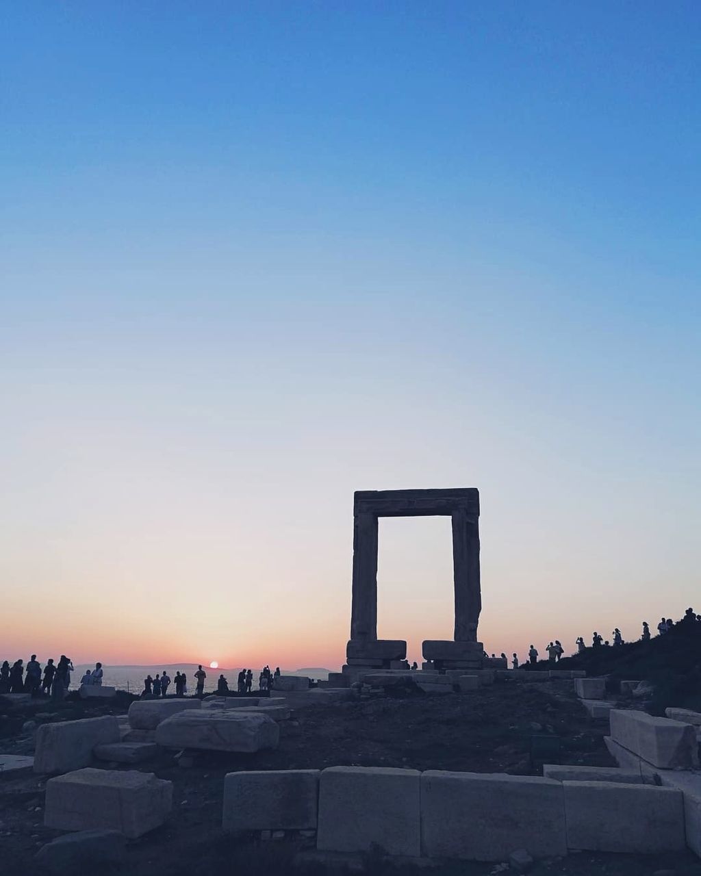 sky, architecture, sunset, built structure, clear sky, copy space, nature, city, building exterior, no people, blue, orange color, outdoors, silhouette, building, travel, history, travel destinations, tourism, archaeology