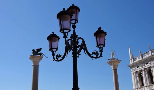 Low angle view of street light against clear sky