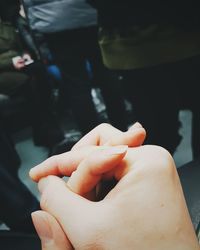 Couples holding hands in subway in seoul, south korea