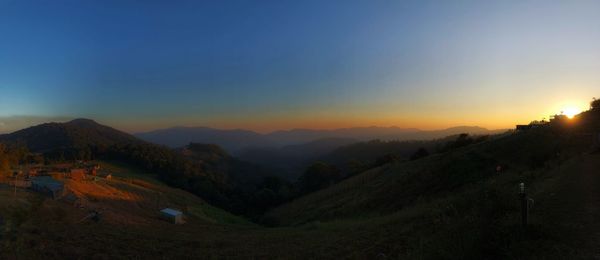 Scenic view of mountains against sky during sunset