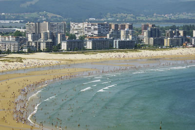 High angle view of beach and buildings in city