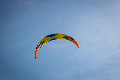 Low angle view of kite flying against sky