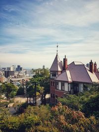 High angle view of houses and buildings against sky