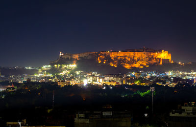 Illuminated buildings in city at night